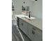 Kitchen island with a sink, dishwasher, and modern cabinetry at 3324 Sw 137Th Loop, Ocala, FL 34473