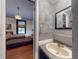 Attached ensuite with textured walls and a sink that is open to the bedroom at 3471 Whitner Way, Sanford, FL 32773