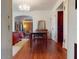 Open dining area with hardwood floors, natural light and seamless flow into adjacent rooms at 3471 Whitner Way, Sanford, FL 32773