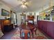 Dining room featuring a large wooden table, colorful rug, and built-in shelves with colorful accents at 3471 Whitner Way, Sanford, FL 32773