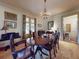 Elegant dining room with a chandelier, wood table and chairs, and classic decor, perfect for entertaining at 3471 Whitner Way, Sanford, FL 32773