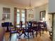 Formal dining room featuring a chandelier, rich wood table, and seating for six guests at 3471 Whitner Way, Sanford, FL 32773