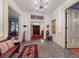 Grand foyer showcasing marble floors, chandelier, and access to various rooms at 3471 Whitner Way, Sanford, FL 32773