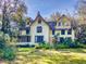 Charming two-story home with intricate architectural details, lush landscaping, and a well-manicured lawn at 3471 Whitner Way, Sanford, FL 32773
