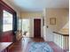 Hallway with original hardwood floors, classic wainscoting, and a vintage rug leading to bedrooms at 3471 Whitner Way, Sanford, FL 32773