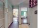 Hallway featuring multiple doorways that provide access to different parts of the home, promoting flow at 3471 Whitner Way, Sanford, FL 32773