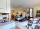 Bright living room with an in-floor fireplace, ceiling fan, and lots of natural light at 3471 Whitner Way, Sanford, FL 32773