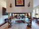 Unique living room with in-floor fireplace, decorative elements, and an open floor plan at 3471 Whitner Way, Sanford, FL 32773