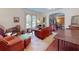 Charming living room with classic furniture, arched windows, and a cozy atmosphere at 3471 Whitner Way, Sanford, FL 32773