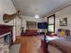 Spacious main bedroom features a decorative fireplace and hardwood floors at 3471 Whitner Way, Sanford, FL 32773