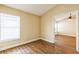 Bedroom with wood floors and a bright window at 3814 Aiden Pl, Apopka, FL 32703