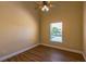 Bedroom featuring wood-look floors and natural light from the window at 3814 Aiden Pl, Apopka, FL 32703