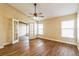 Bedroom with wood floors, ceiling fan, and natural light at 3814 Aiden Pl, Apopka, FL 32703