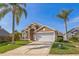 Charming one-story home with a two-car garage, and manicured lawn at 3814 Aiden Pl, Apopka, FL 32703