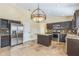 Eat-in kitchen featuring stainless steel appliances, large island, and granite countertops at 3814 Aiden Pl, Apopka, FL 32703