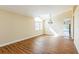 Bright living room featuring hard wood floors and large window at 3814 Aiden Pl, Apopka, FL 32703