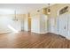Open-plan living room with high ceilings and vinyl plank flooring throughout at 3814 Aiden Pl, Apopka, FL 32703