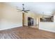 Open-concept living room flows into kitchen with modern appliances and counter seating at 3814 Aiden Pl, Apopka, FL 32703