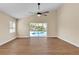 Living room with vinyl plank floors and sliding glass doors that open to the pool at 3814 Aiden Pl, Apopka, FL 32703