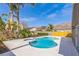 Backyard pool area surrounded by palm trees, lush plants and manicured landscape at 3814 Aiden Pl, Apopka, FL 32703