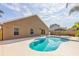 In-ground pool with a sunbathing patio area outside the rear of the house at 3814 Aiden Pl, Apopka, FL 32703