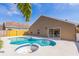 Backyard view of a sparkling pool with a spa and well-maintained landscaping on a sunny day at 3814 Aiden Pl, Apopka, FL 32703