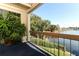 Balcony view of the lake and surrounding greenery at 626 Orange Dr # 242, Altamonte Springs, FL 32701