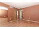 Bedroom features hardwood floors and mirrored closet doors at 626 Orange Dr # 242, Altamonte Springs, FL 32701