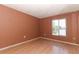 Bedroom with hardwood floors and a view of the lake at 626 Orange Dr # 242, Altamonte Springs, FL 32701