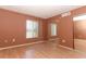 Bedroom features hardwood floors, a window, and mirrored closet doors at 626 Orange Dr # 242, Altamonte Springs, FL 32701
