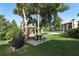 Relaxing gazebo near a sandy volleyball court with BBQ and picnic table at 626 Orange Dr # 242, Altamonte Springs, FL 32701