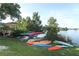 Assortment of kayaks stored near the lake and a wooden gazebo at 626 Orange Dr # 242, Altamonte Springs, FL 32701