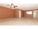 Open-concept living room features tile floors and a pass-through to the kitchen at 626 Orange Dr # 242, Altamonte Springs, FL 32701