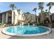 Sparkling community pool surrounded by palm trees and well-maintained landscaping at 626 Orange Dr # 242, Altamonte Springs, FL 32701