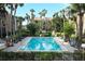 Beautiful community pool surrounded by palm trees, providing a relaxing oasis at 626 Orange Dr # 242, Altamonte Springs, FL 32701