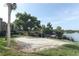 Sandy volleyball court near a lake and an area for kayak storage at 626 Orange Dr # 242, Altamonte Springs, FL 32701