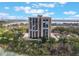 An aerial shot showcases the condo building against a backdrop of a blue sky and lake views at 7550 Hinson St # 11C, Orlando, FL 32819