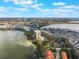 Aerial view of the property, lake, and city in the distance at 7550 Hinson St # 11C, Orlando, FL 32819