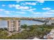 Condominium next to a lake with distant city views from an aerial perspective at 7550 Hinson St # 11C, Orlando, FL 32819