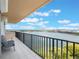 Enjoy picturesque lake views from the private balcony with comfortable seating at 7550 Hinson St # 11C, Orlando, FL 32819