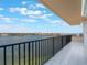 A serene balcony offers stunning lakefront views and relaxation at 7550 Hinson St # 11C, Orlando, FL 32819