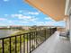 Enjoy spectacular views from this spacious balcony, complete with tile flooring, wrought iron railings, and seating at 7550 Hinson St # 11C, Orlando, FL 32819