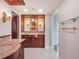Elegant bathroom featuring custom cabinetry and marble countertops at 7550 Hinson St # 11C, Orlando, FL 32819
