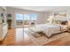 Comfortable bedroom with balcony access and a cozy rug under a decorative bed frame at 7550 Hinson St # 11C, Orlando, FL 32819
