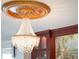 Ornate crystal chandelier enhancing the home's luxurious appeal at 7550 Hinson St # 11C, Orlando, FL 32819