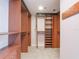 Spacious walk-in closet with custom shelving and ample storage at 7550 Hinson St # 11C, Orlando, FL 32819