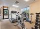 Exercise room with treadmills, exercise bikes, and free weights at 7550 Hinson St # 11C, Orlando, FL 32819