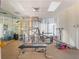 Well equipped exercise room featuring modern equipment, weights and mirrors at 7550 Hinson St # 11C, Orlando, FL 32819