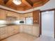 Well-appointed kitchen with custom cabinets, granite counters, and a breakfast bar at 7550 Hinson St # 11C, Orlando, FL 32819
