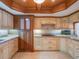 Detailed kitchen featuring custom cabinets, granite counters, and modern appliances at 7550 Hinson St # 11C, Orlando, FL 32819